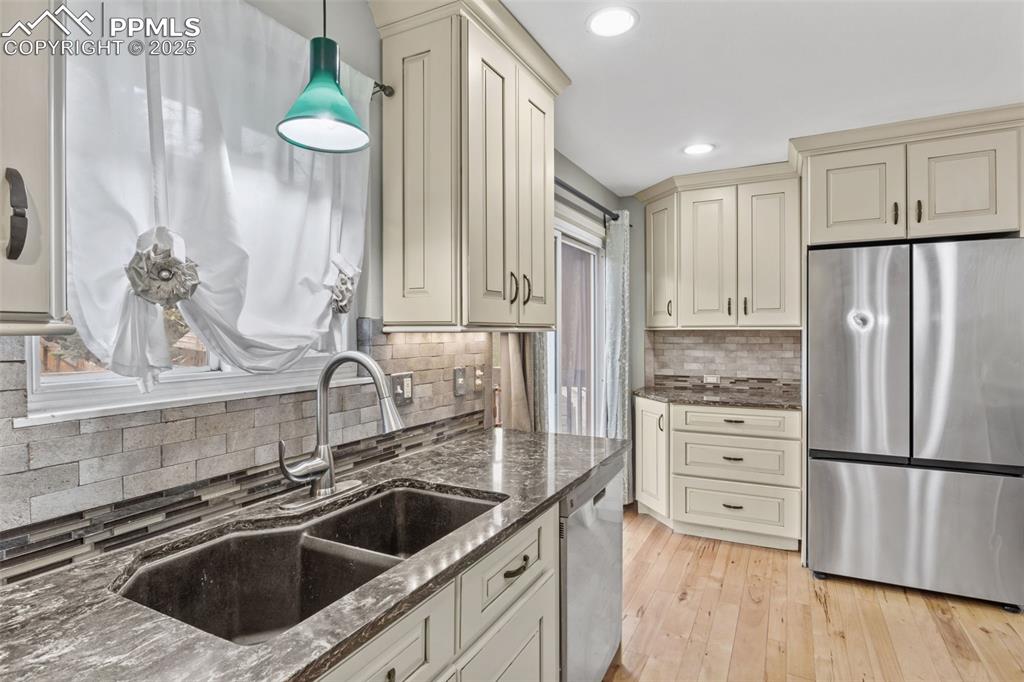 Window over the sink as you stare out into nature while cleaning up after the fam
