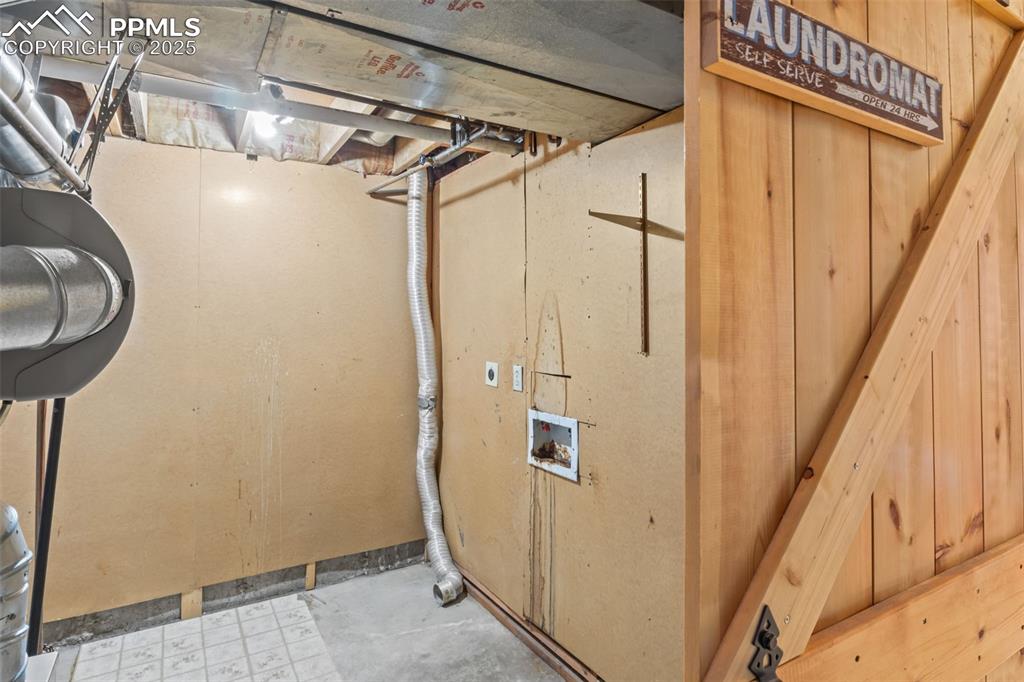 Imagine your washer and dryer here behind the sliding barn door