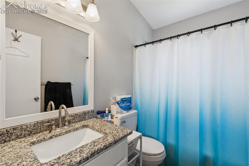 Bathroom with vanity and a shower with shower curtain