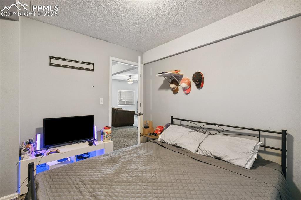 Bedroom with a textured ceiling
