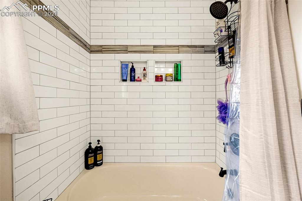 Full bathroom featuring shower / tub combo