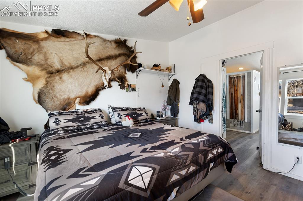 The main bedroom has wood flooring, and a ceiling fan!