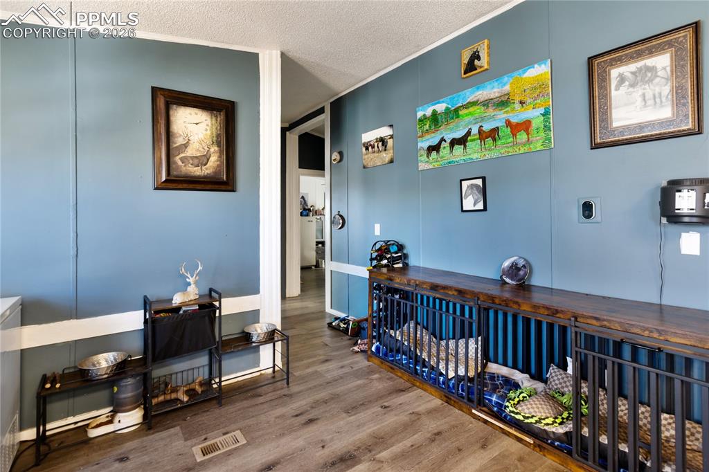 The dining space with wood finished floors, and ornamental molding!
