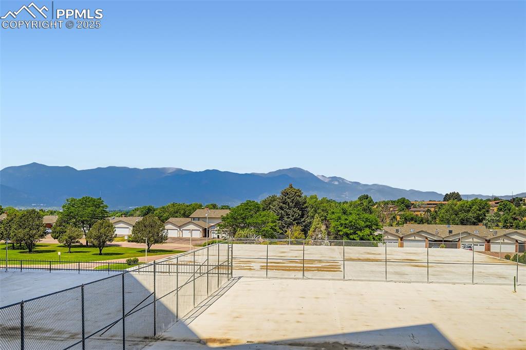 View of mountain backdrop featuring nearby suburban area