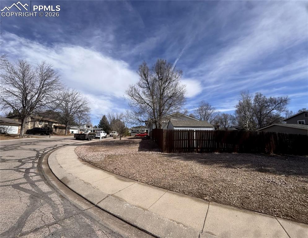 Large corner lot with huge storage shed in the backyard.