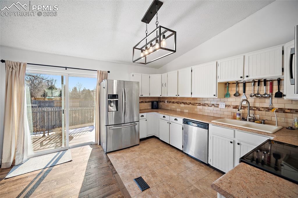 Walk out to the deck and backyard. Great for BBQ's.