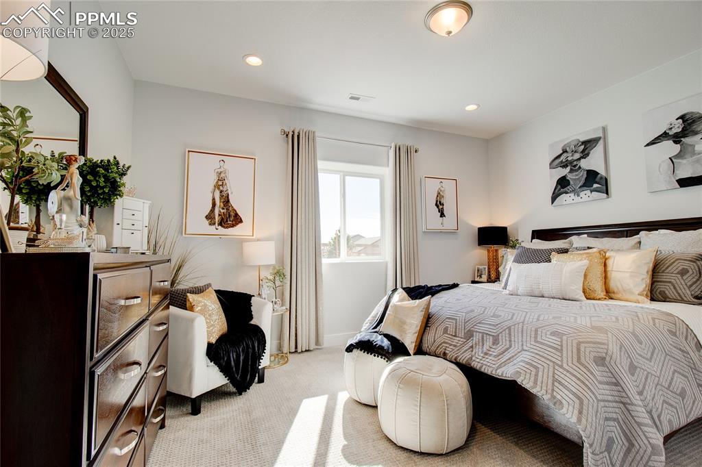 Carpeted bedroom featuring recessed lighting