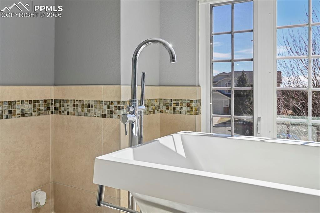 Detailed view of tile walls and a textured wall