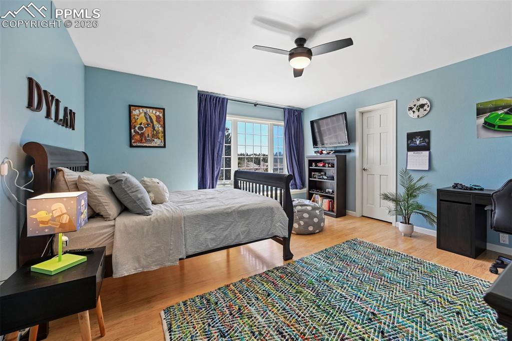 Bedroom featuring light wood-style flooring and ceiling fan