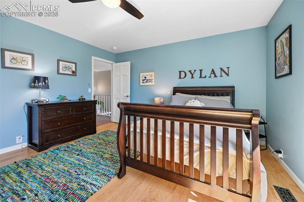 Bedroom featuring light wood-style flooring and ceiling fan