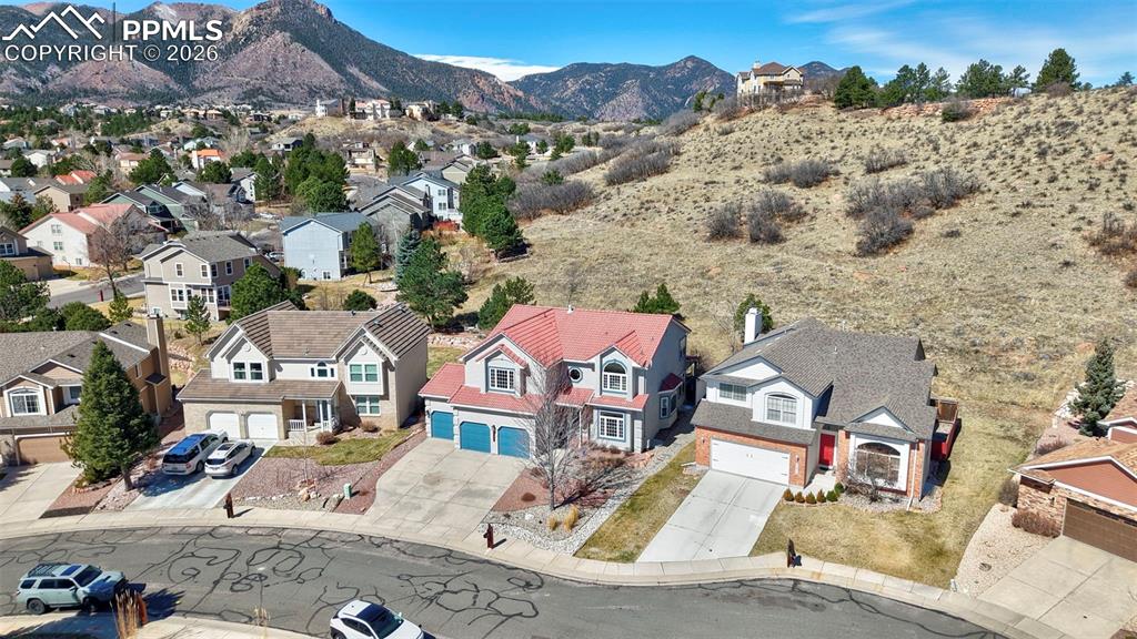 Aerial view of residential area with a mountain backdrop