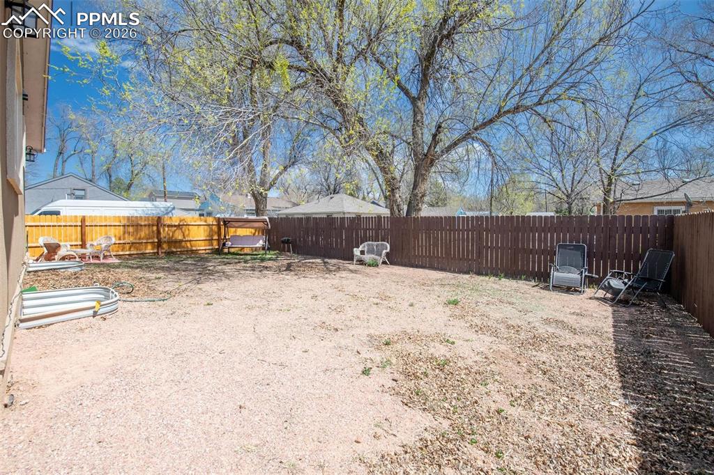 Huge fenced yard to make your own.