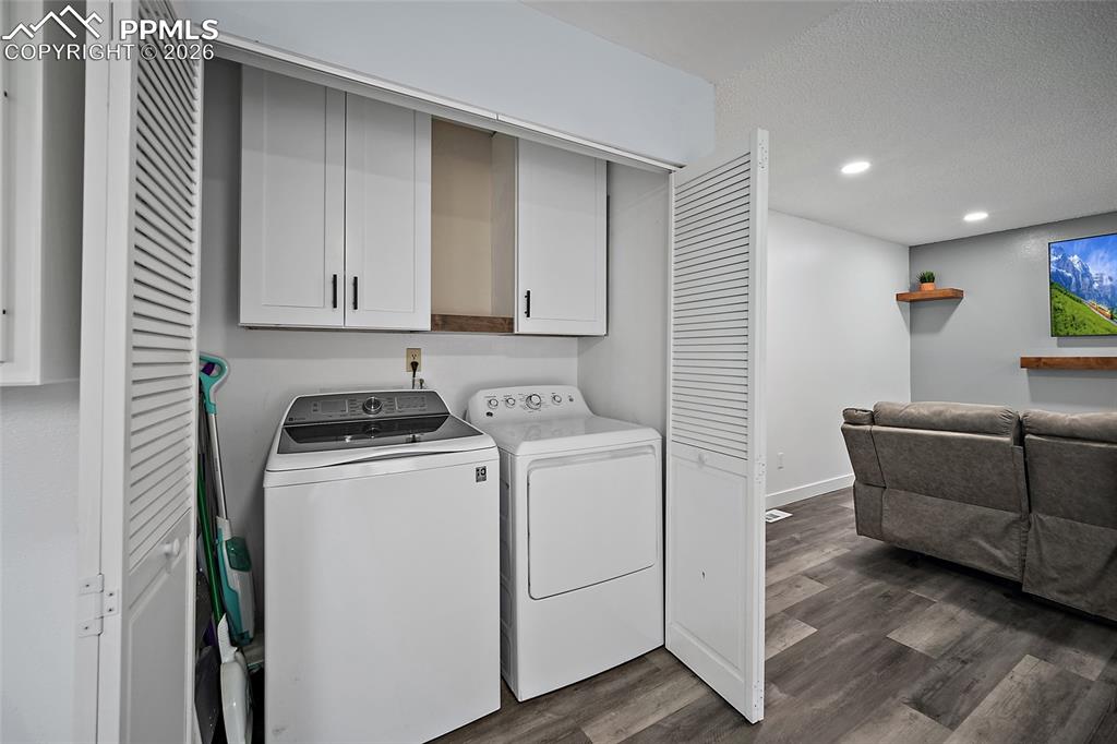 Laundry area with cabinet space, washer & dryer