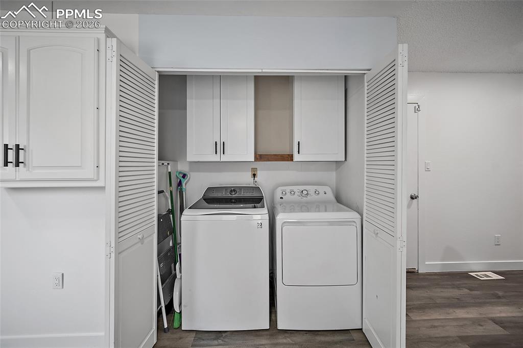 Laundry area with cabinet space, washer & dryer