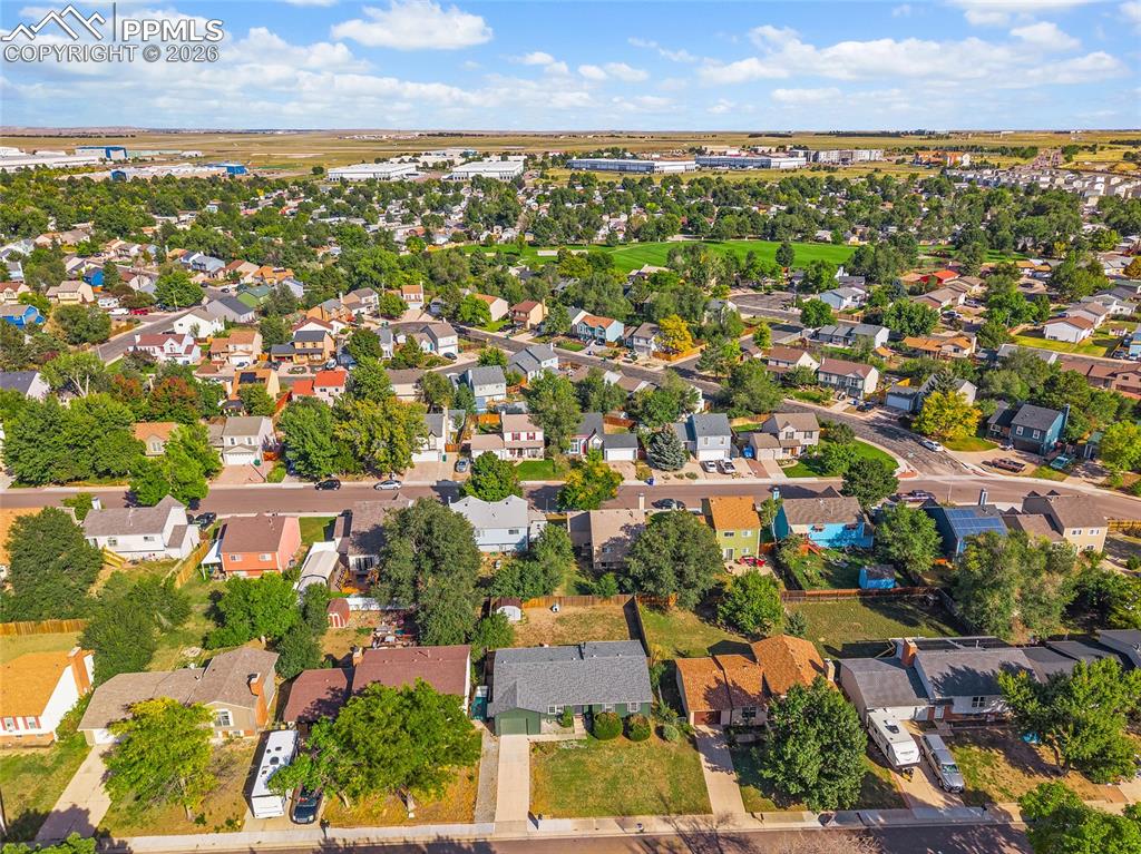Aerial overview of property's location with nearby suburban area