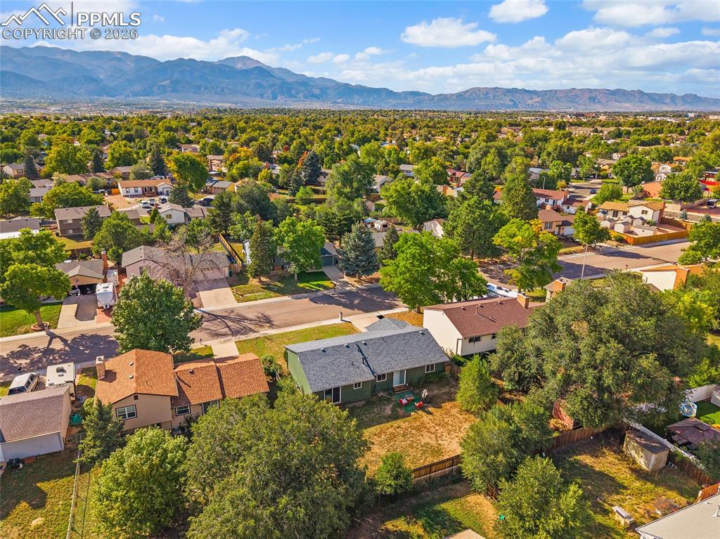 Aerial view of residential area featuring a mountain backdrop