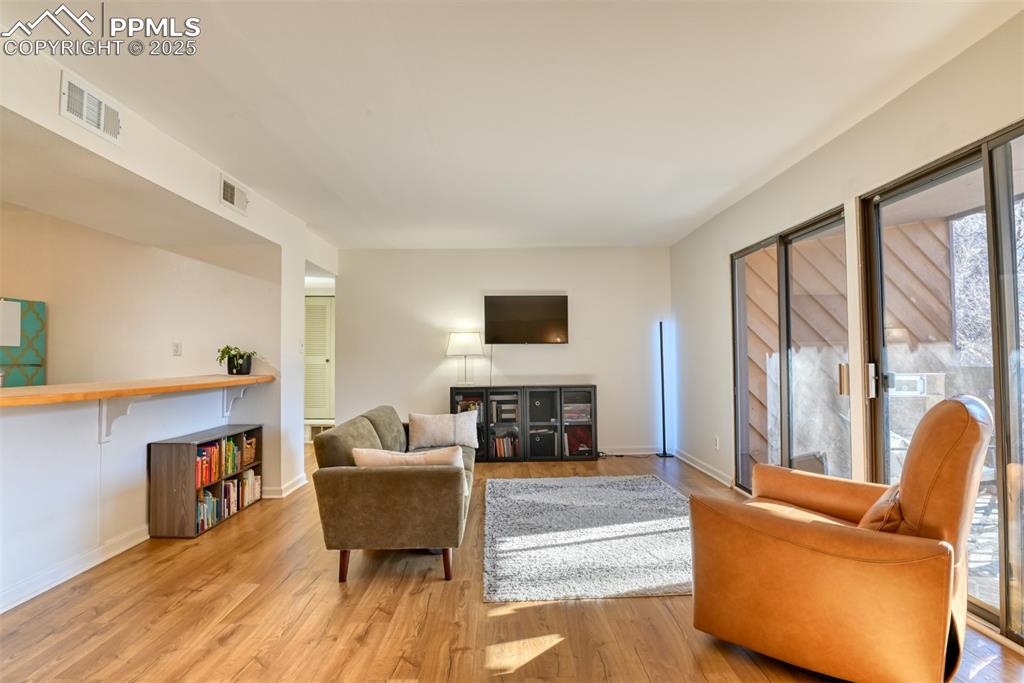Living room featuring light wood finished floors and baseboards