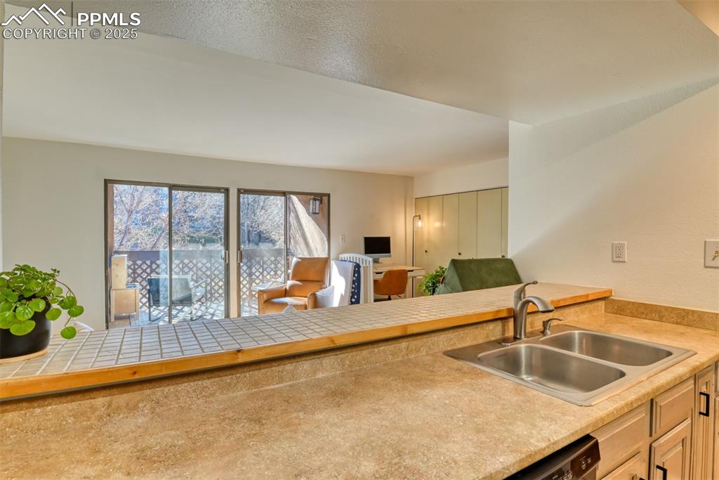 Kitchen featuring open floor plan and light countertops