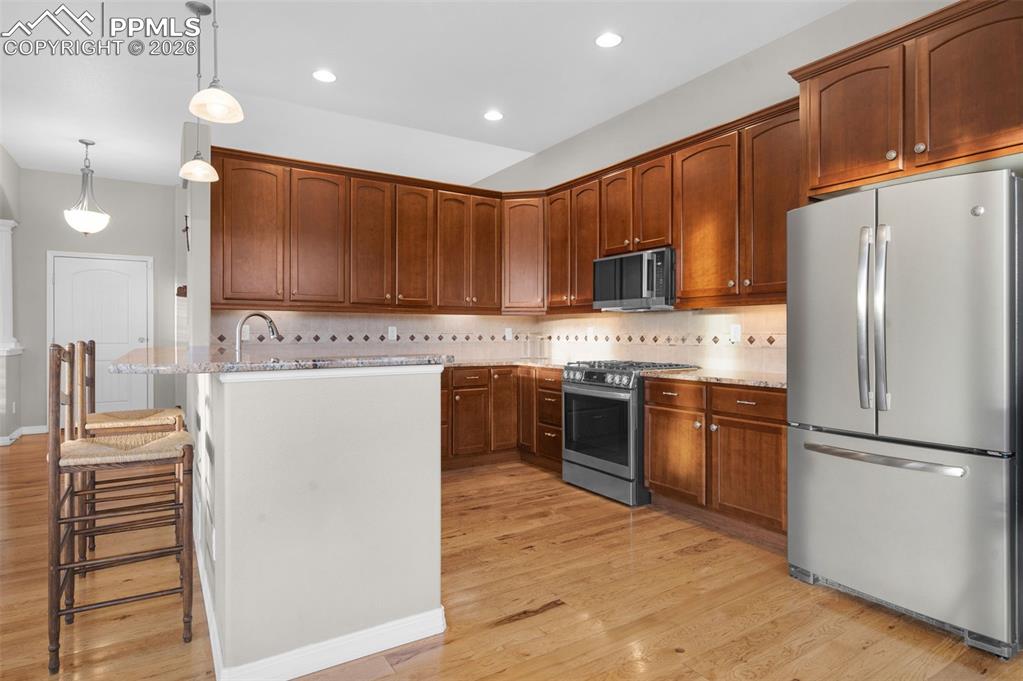 Granite, hickory floors, stainless steel