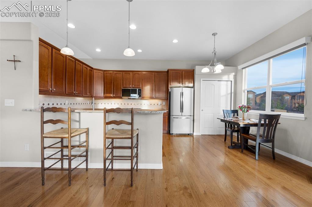 Granite, hickory floors, stainless steel