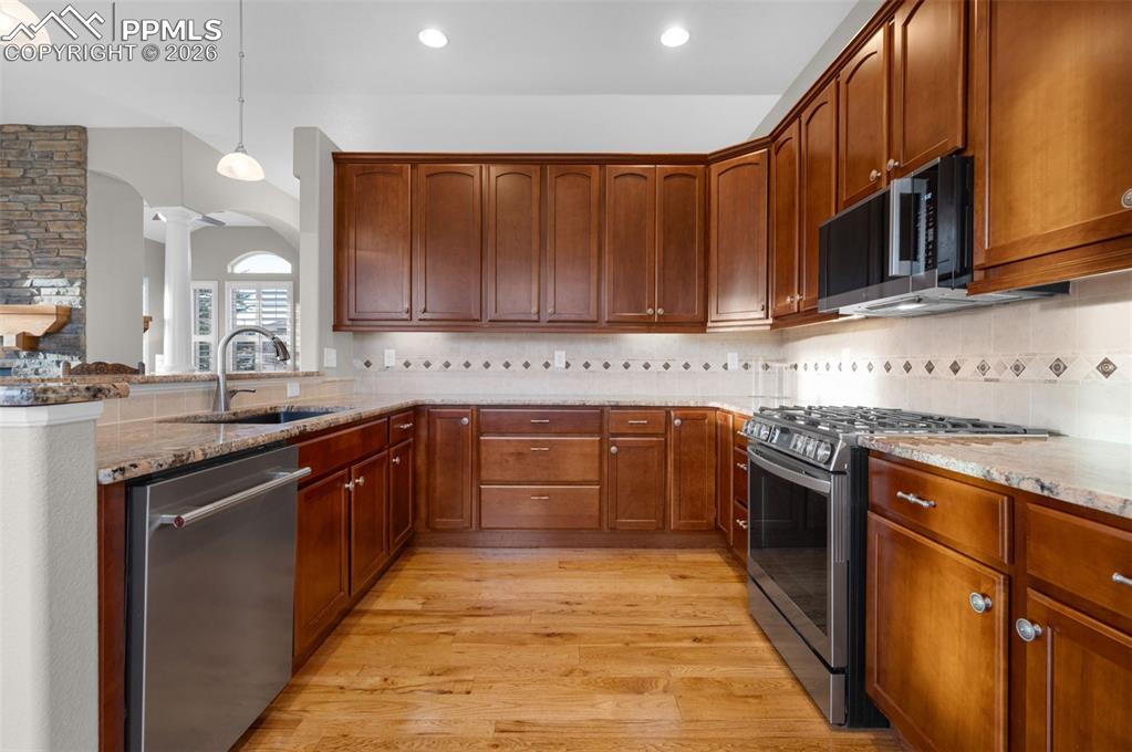 Granite, hickory floors, stainless steel