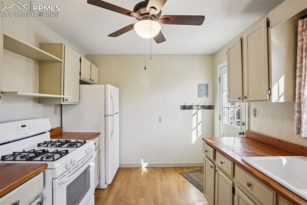 Kitchen with gas burning stove, matching appliances and a walk out to the back deck/yard