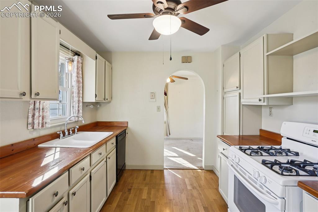 Kitchen with gas burning stove, matching appliances and a walk out to the back deck/yard