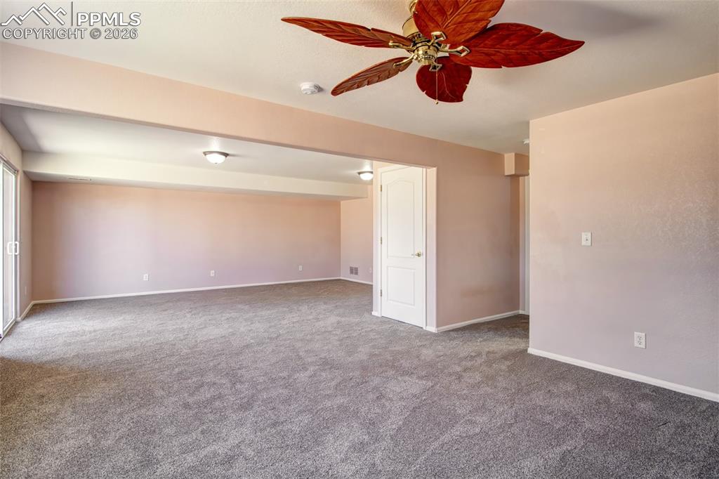 Recreation room in basement with walk out to covered patio