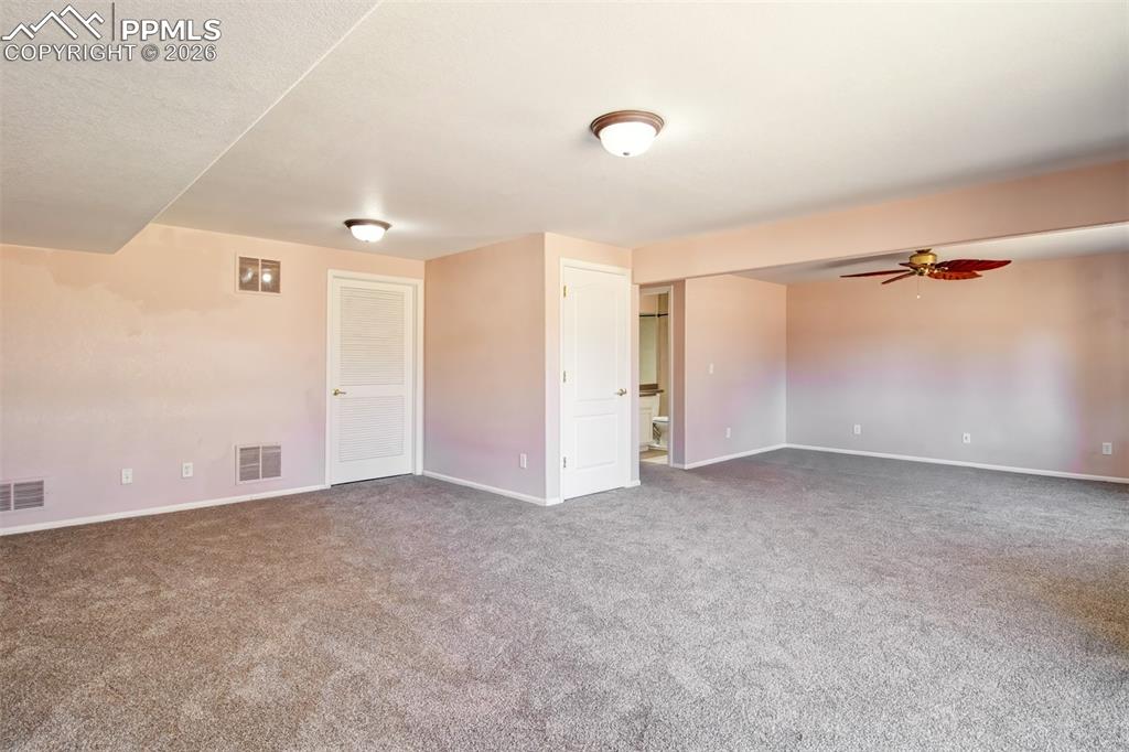 Recreation room in basement with walk out to covered patio