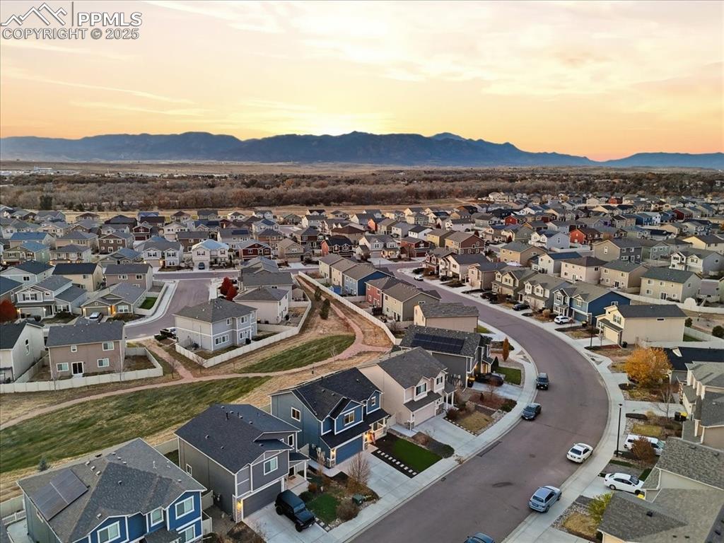 Aerial view at dusk of a residential view and a mountain view