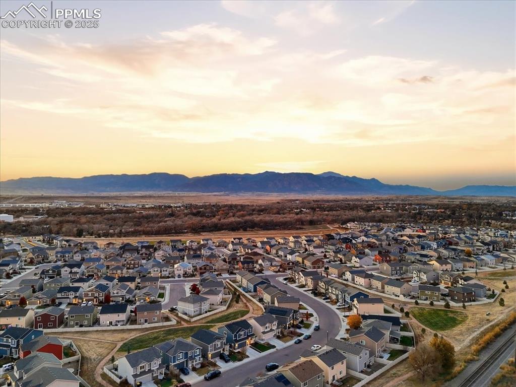 Aerial view at dusk of a residential view and a mountain view