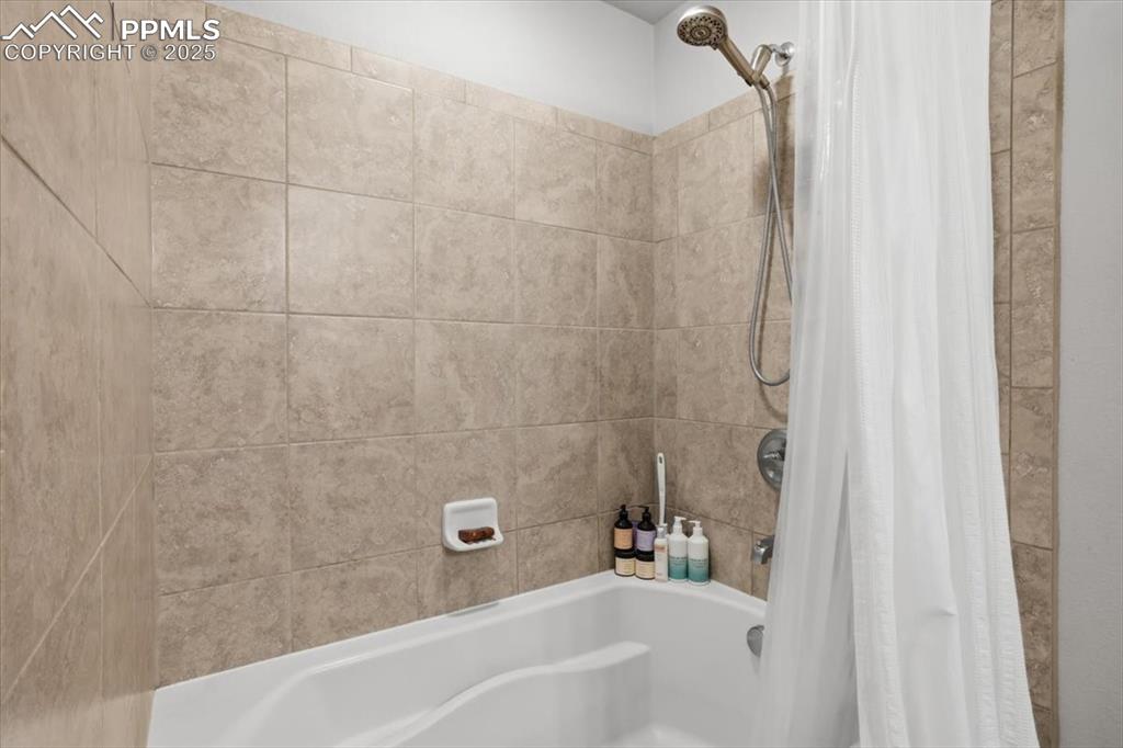 Full bathroom featuring shower / tub combo