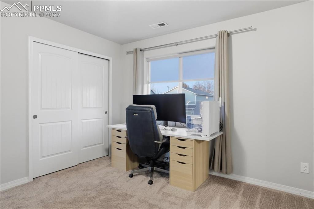 Office space featuring light colored carpet