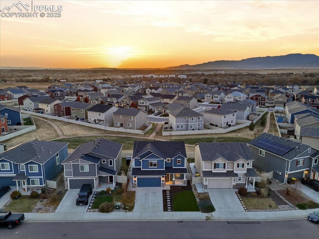 Aerial view at dusk of a residential view and a mountain view