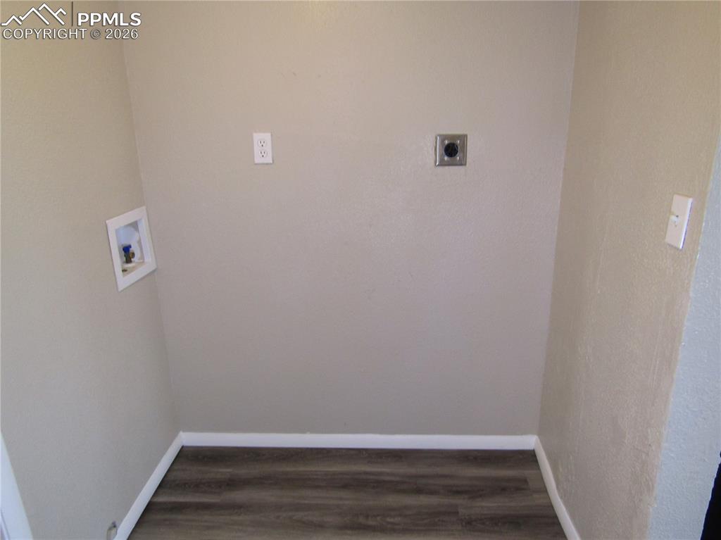 Laundry room featuring washer hookup, dark wood finished floors, and electric dryer hookup