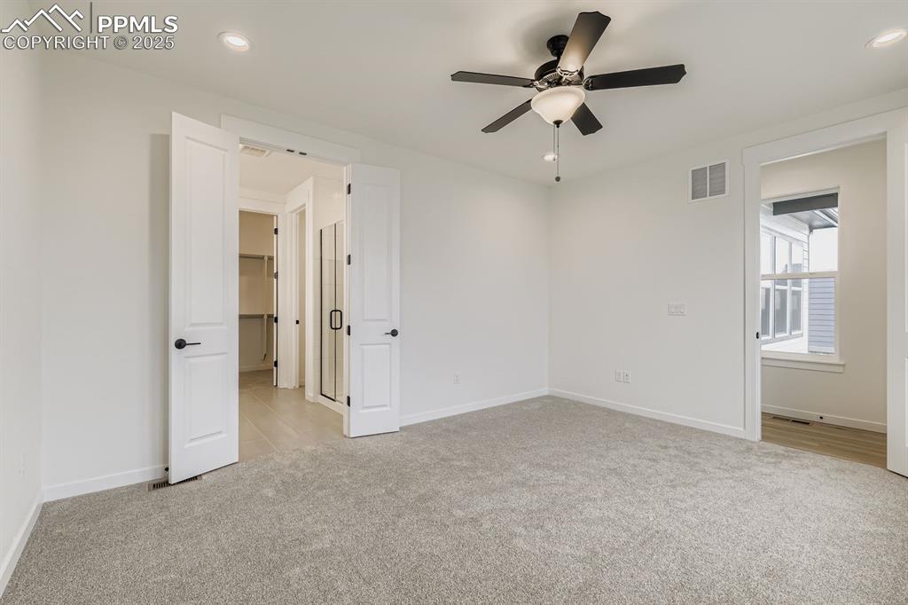 Unfurnished bedroom with light carpet, recessed lighting, and ceiling fan