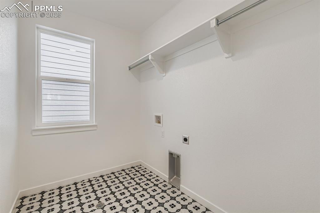 Laundry room with electric dryer hookup and washer hookup