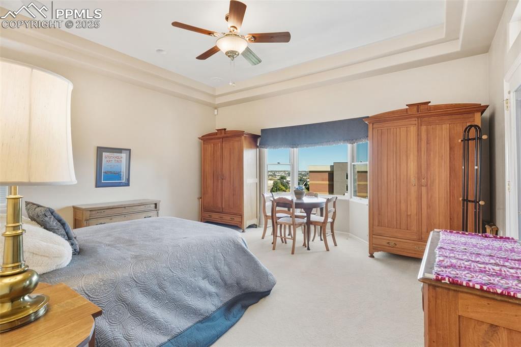 Large bedroom with sitting area and walk-out