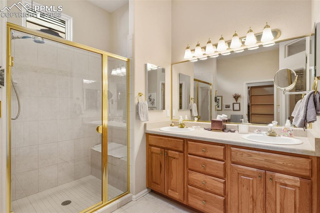 Double vanities. stand-alone shower with seat