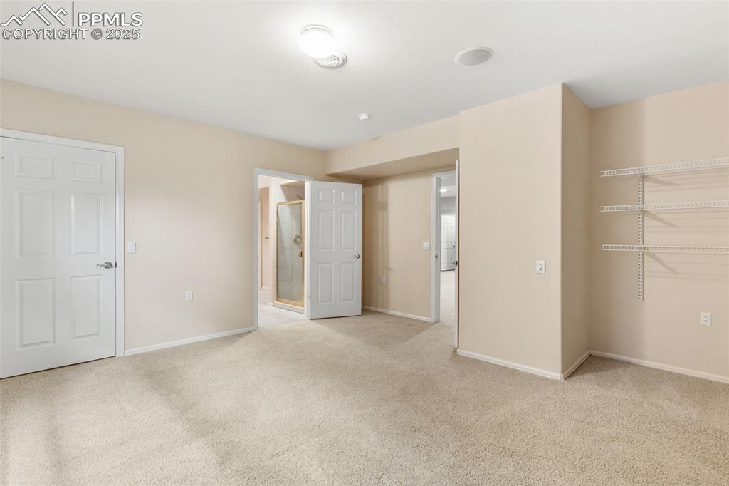 Downstairs bedroom looking towards bath which is between the 2 bedrooms
