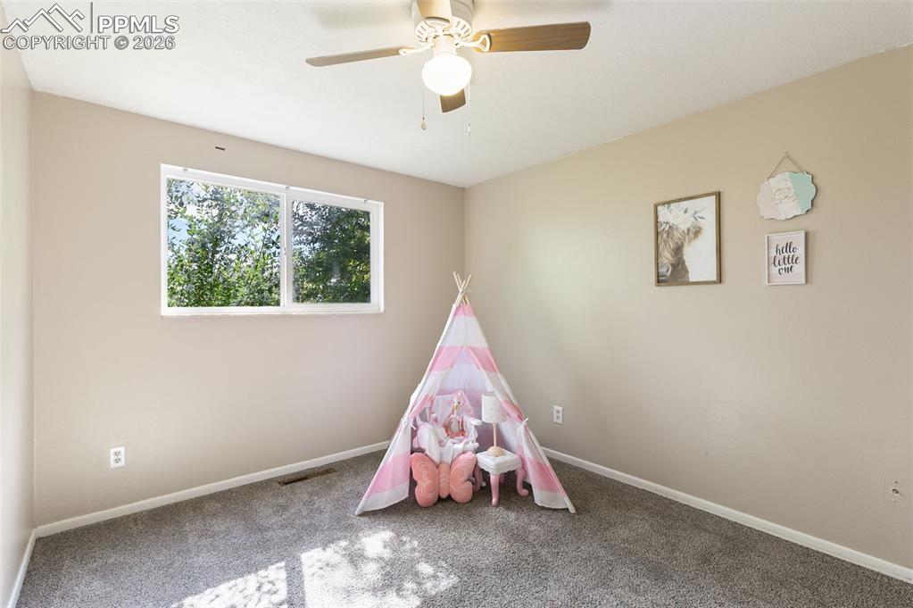 Bedroom with carpet floors and ceiling fan