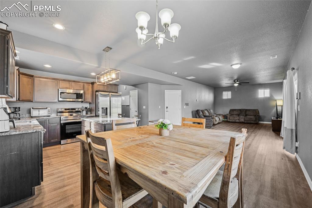 Make dining area off kitchen or in front of sliding glass doors.