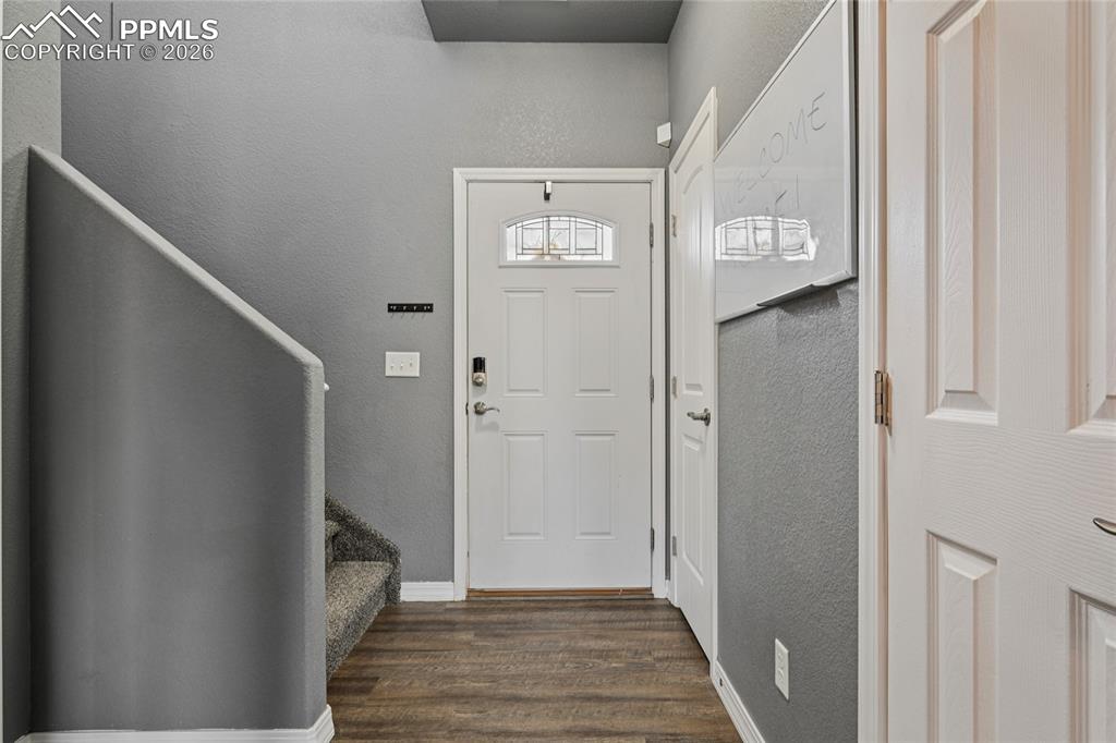 The wide entryway provides space for a backpack drop area or coat tree.