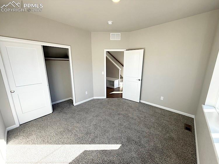 Great room with engineered wood flooring, floor outlet, LED Lighting, ceiling fan, gas fireplace with stacked stone surround, and walk out to your private deck!