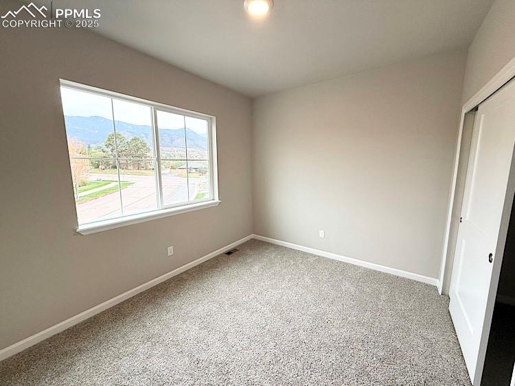 Primary bathroom featuring double sinks, a quartz countertop, and a decorative tile backsplash.