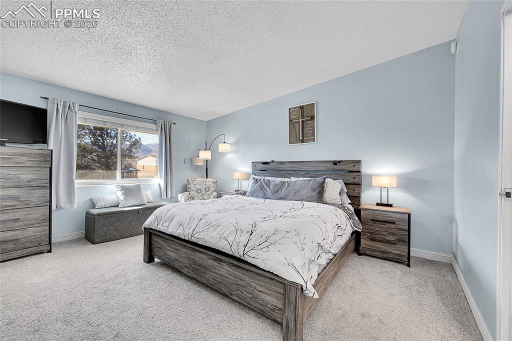 14x15 primary bedroom with new carpet. 