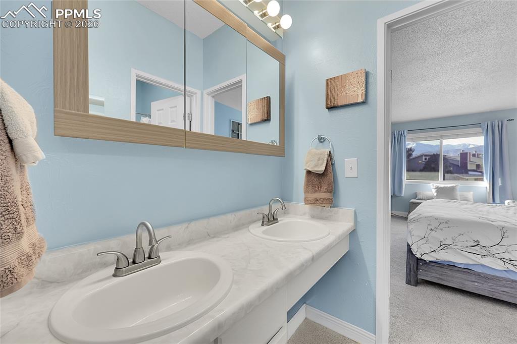 Jack & Jill bathroom shared by both upstairs bedrooms. 