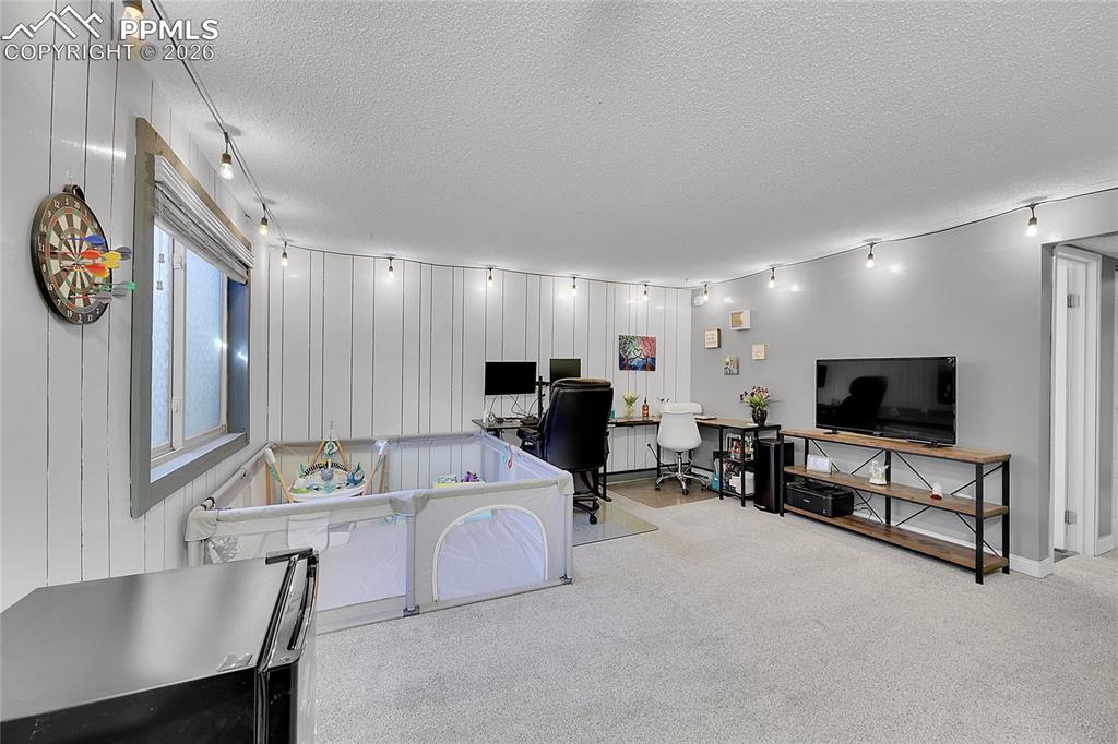 Basement family room with new carpet. 