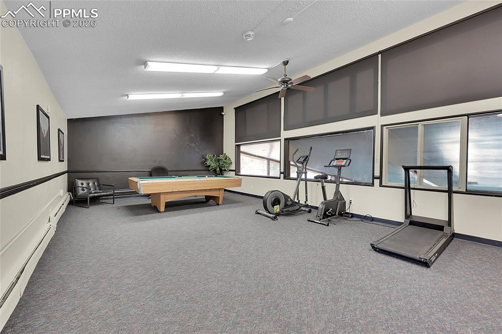 Exercise room w/workout equipment. 