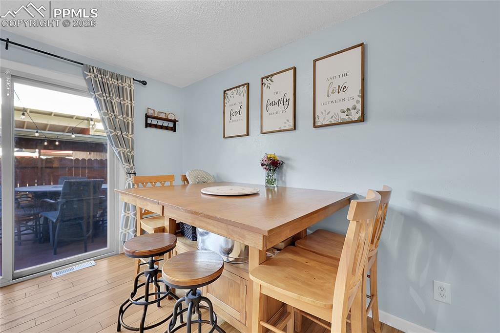 Dining area with walkout to the fenced patio--great for entertaining. 